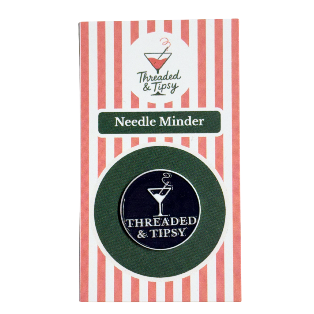 Threaded & Tipsy Needle Minder packaging with red and white striped design