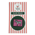 Zebra needle minder on striped packaging with 'Threaded & Tipsy' branding